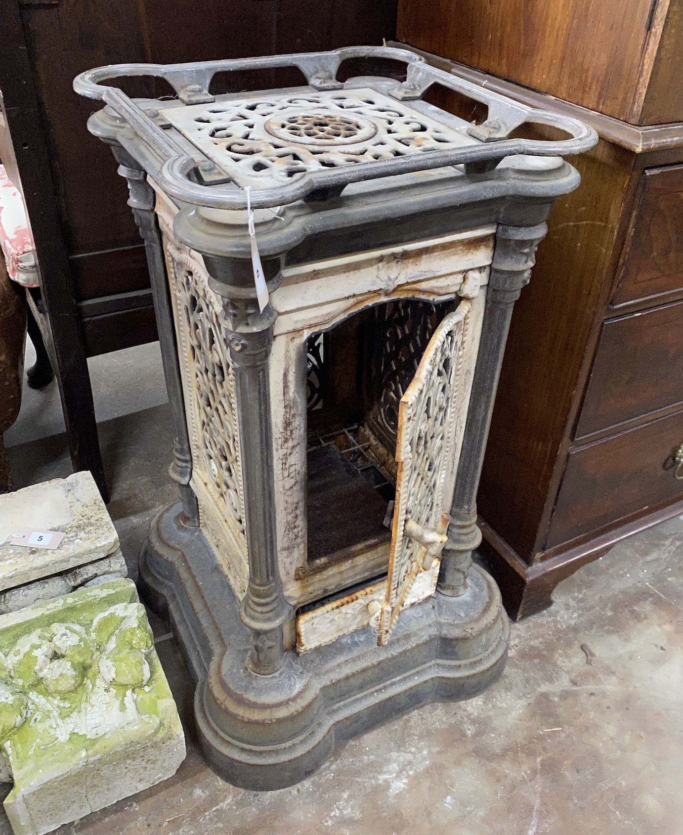 A 19th century French enamelled cast iron conservatory heater, lacking burner, width 44cm, height 85cm
